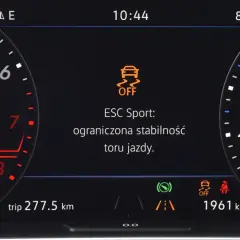 Kontrolka ESP OFF na desce rozdzielczej samochodu, z napisem "ESC Sport: ograniczona stabilność toru jazdy".