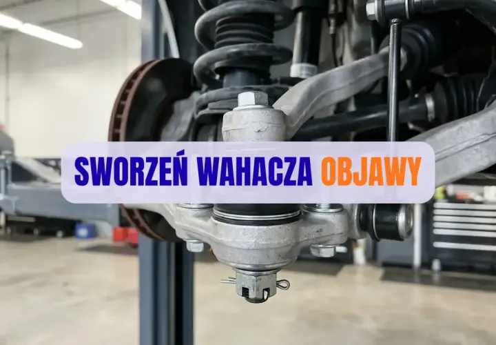 Zbliżenie na sworzeń wahacza samochodu w warsztacie.