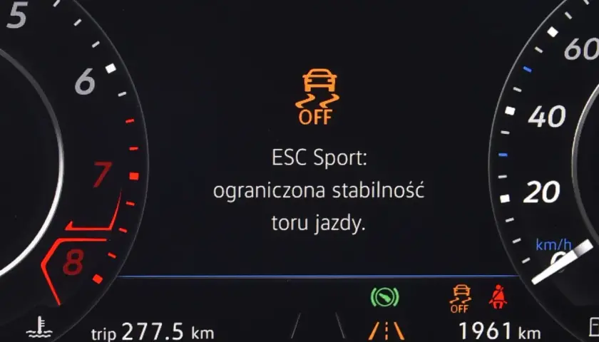 Kontrolka ESP OFF na desce rozdzielczej samochodu, z napisem "ESC Sport: ograniczona stabilność toru jazdy".