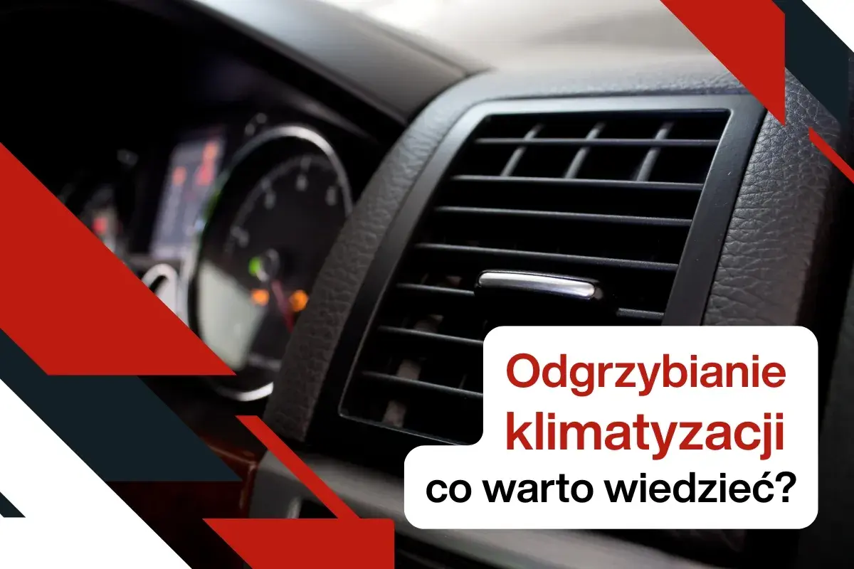 Widok na kratkę nawiewu klimatyzacji samochodowej i fragment deski rozdzielczej.